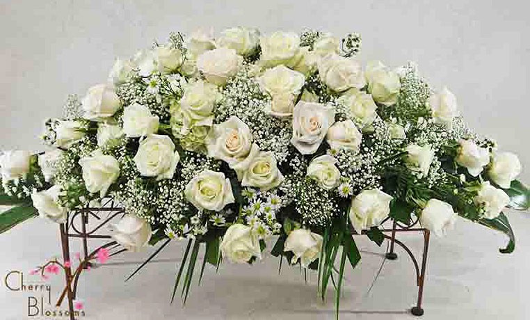Funeral Flowers White roses casket spray to display on the casket or coffin